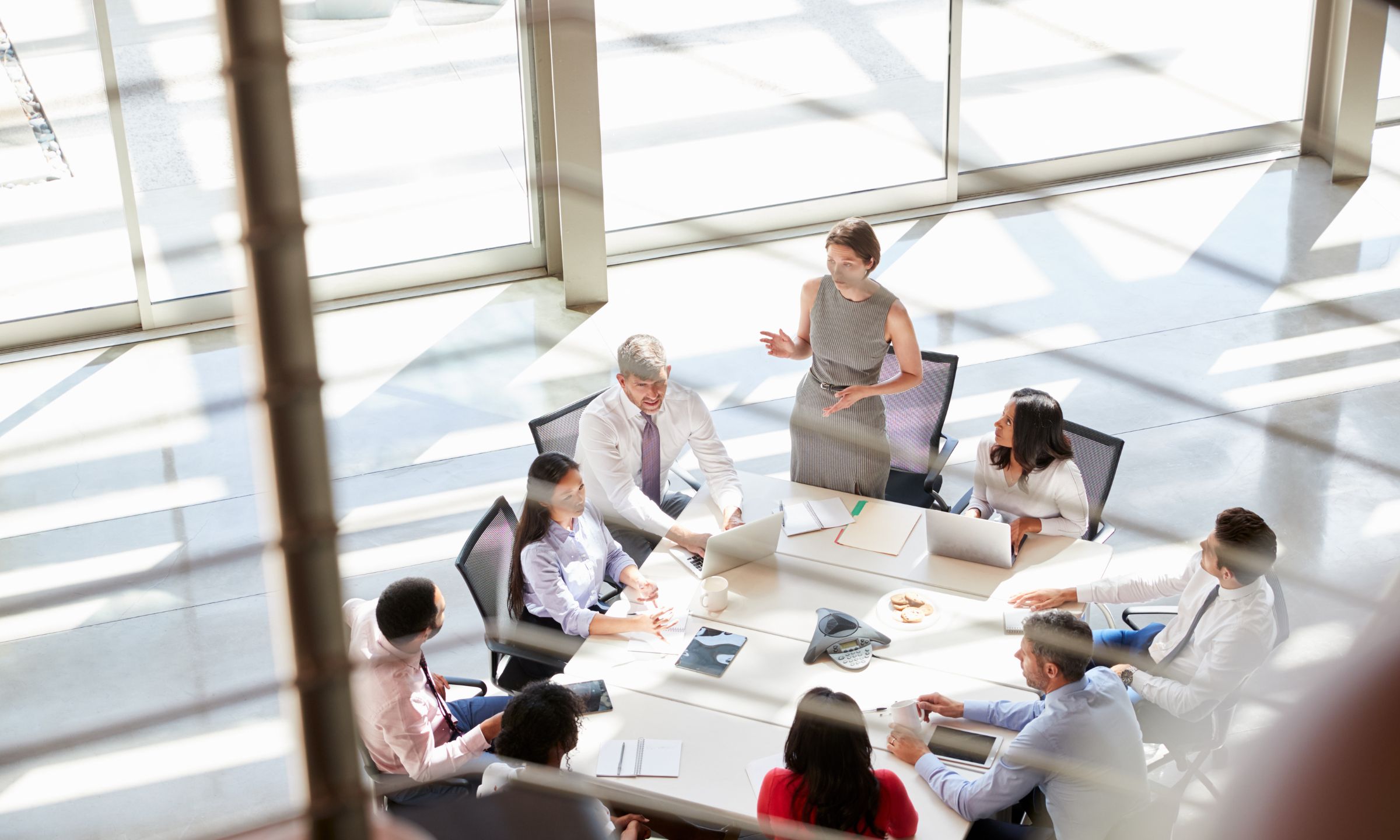 Birds eye view of people sat around a table having a discussion