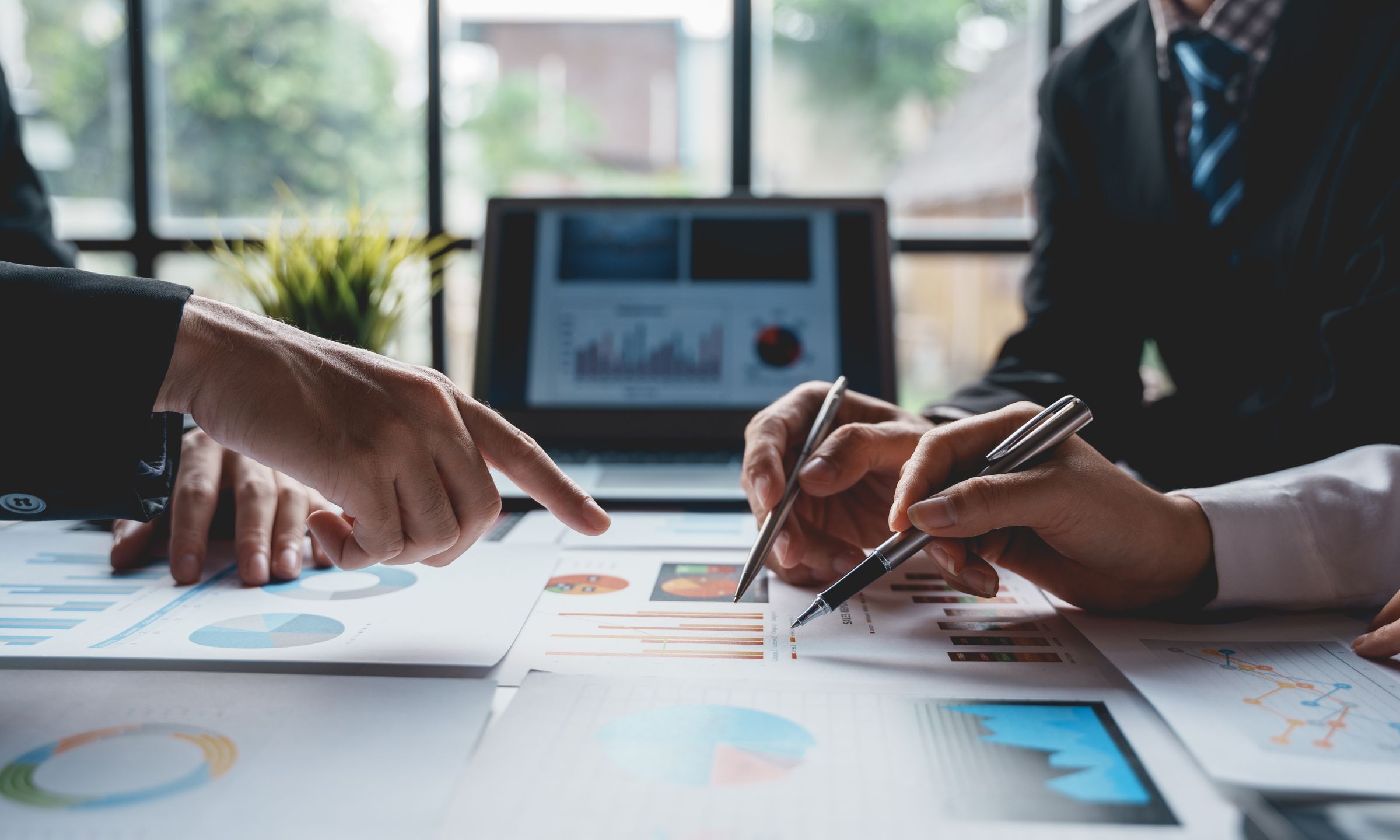 Business professionals reviewing charts and performance data during a strategy meeting